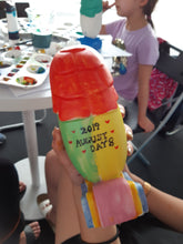 Load image into Gallery viewer, Unleash Your Creative Roar this National Day with the 'Lion's Pride - Paint Your Own Merlion' art workshops.